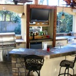Outdoor Living Space With TV and Bar