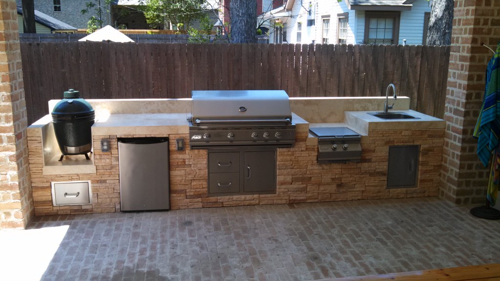 This outdoor kitchen by Outdoor Homescapes of Houston features (from left) a Big Green Egg grill, an RCS outdoor refrigerator, an RCS grill, an RCS side burner and an outdoor sink. More at www.outdoorhomescapes.com/blog