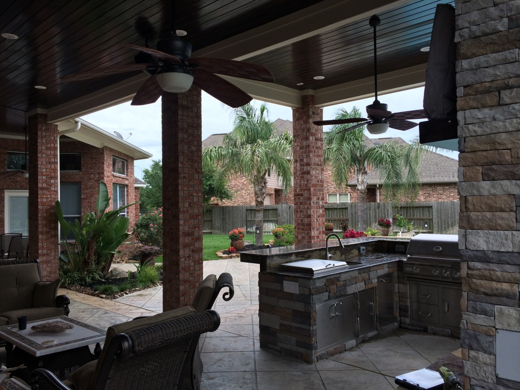 High Outdoor Wood Ceiling Kitchen And Fireplace With Seating