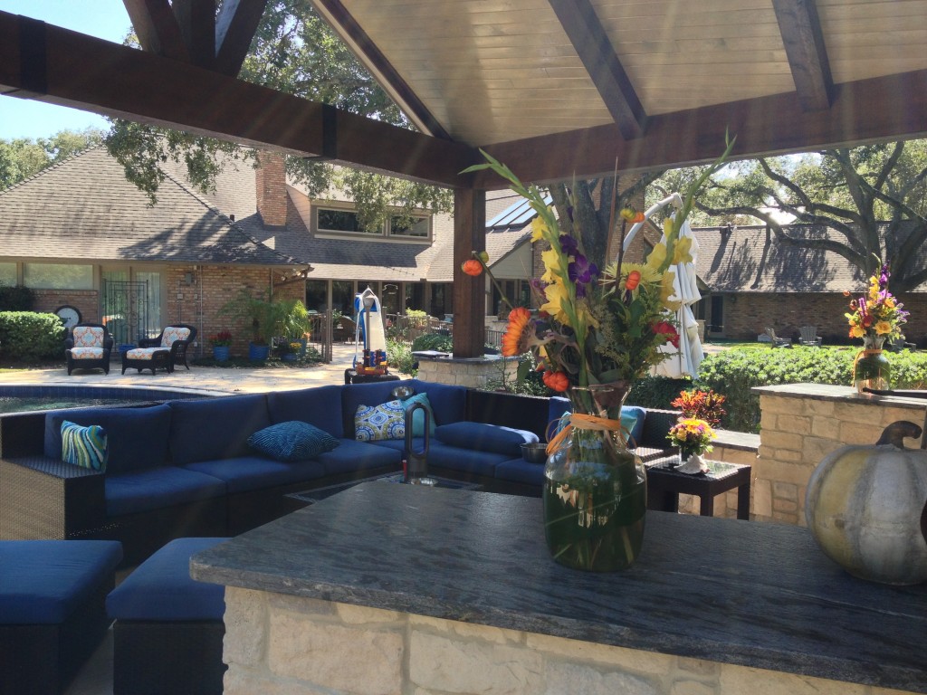 Covered Backyard Living Space with Wooden Beams