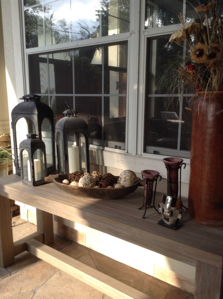 Outdoor furniture like this distressed credenza by Restoration Hardware helped transform this Houston outdoor design by Outdoor Homescapes of Houston. More on this covered patio and outdoor decor project at www.outdoorhomescapes.com