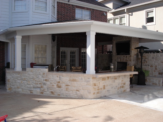 This 400-square-foot covered patio in Houston is perfect for watching football on TV outside. More at www.outdoorhomescapes.com