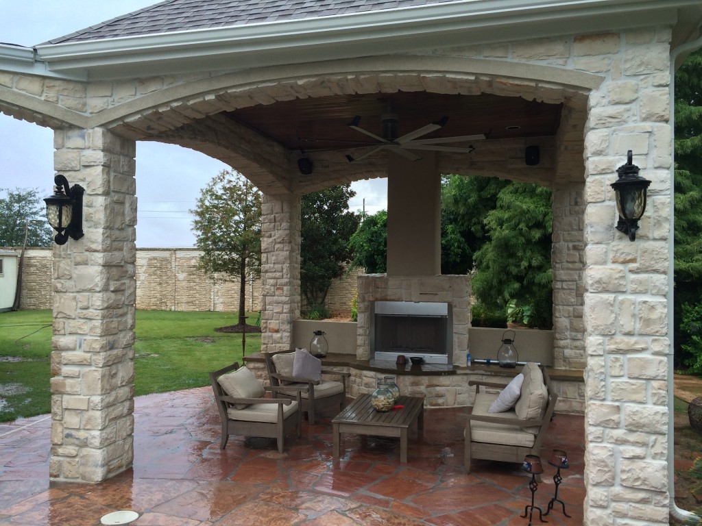 This Houston outdoor sitting area gets warmed up in the cool season with this gas fireplace. This Houston covered patio addition was designed and built by Outdoor Homescapes of Houston. More at www.outdoorhomescapes.com.