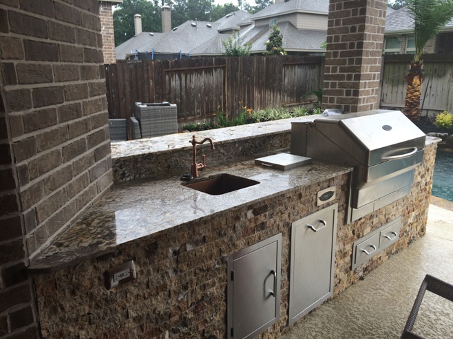 Sophisticated patio kitchen plans - like this one by Outdoor Homescapes of Houston - seamlessly blend high-tech, modern outdoor appliances with rustic, naturalistic outdoor design motifs. More at www.outdoorhomescapes.com/blog.