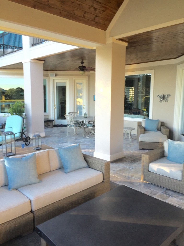 This Houston patio addition by Outdoor Homescapes of Houston features silver travertine flooring and Restoration Hardware furniture and accessories. More at www.outdoorhomescapes.com/blog