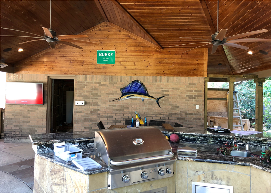 This large covered patio in Houston was designed and built by Homescapes of Houston. The wooden patio ceiling is a tongue-and-groove pine. More at www.outdoorhomescapes.com